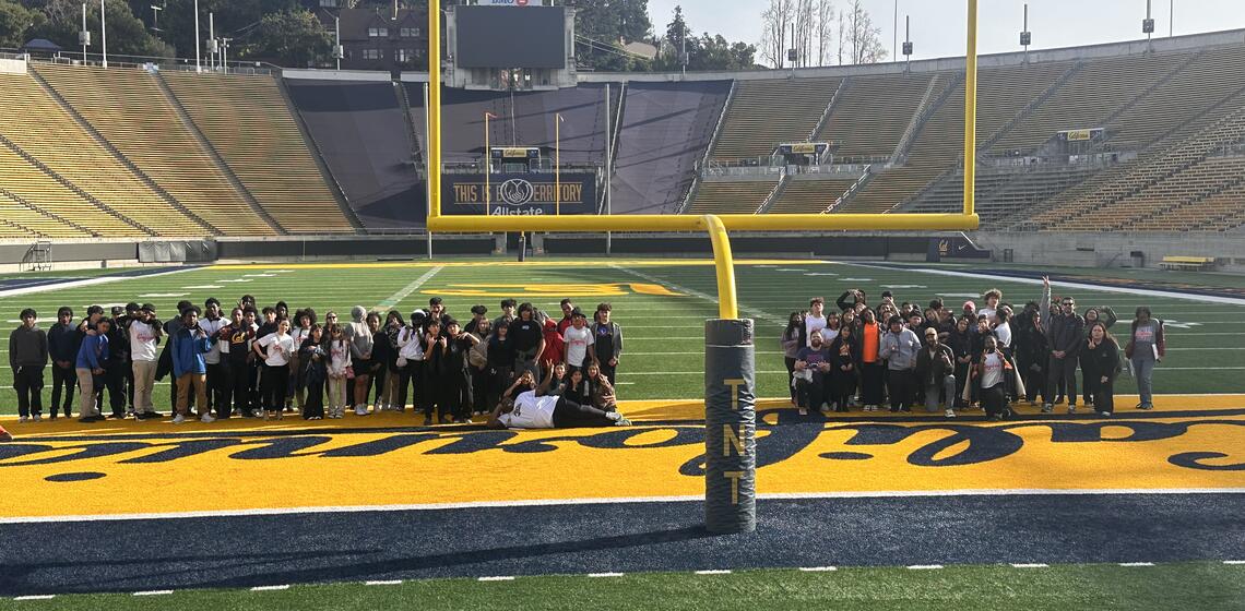 A group of students visiting the Cal football field.